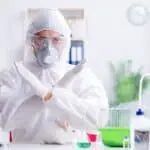 Scientist making a cross symbol in the lab with rabbit